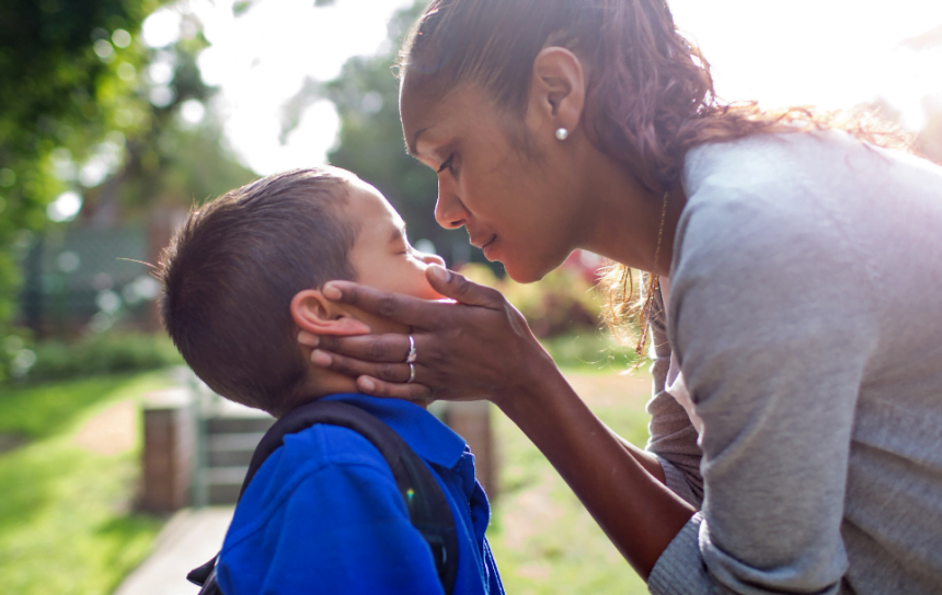 Mother hold child's face
