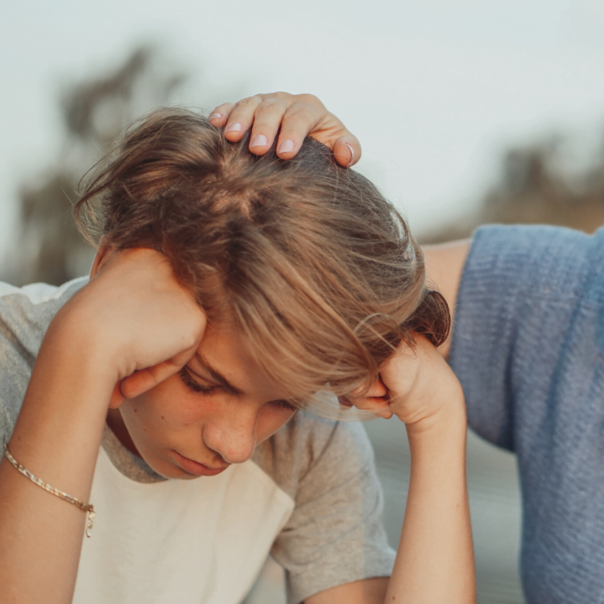 Mother supporting son