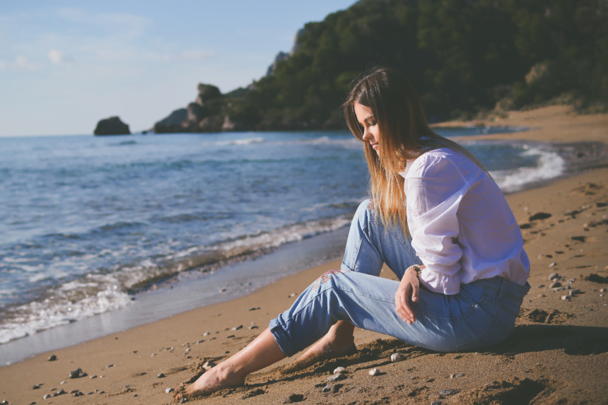 Woman thinking on the beach