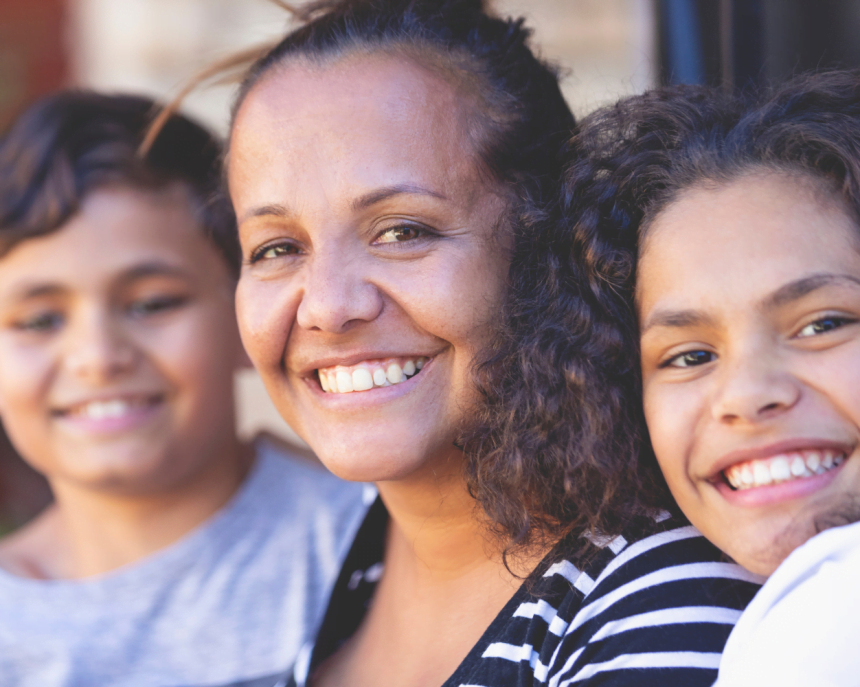 Smiling mother with two children