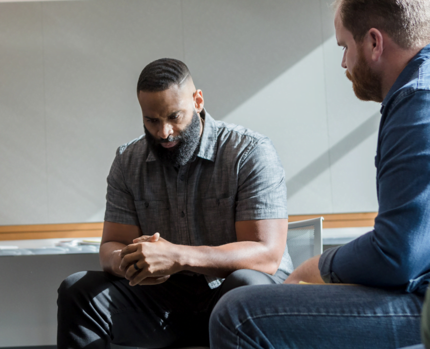 Men talking in therapy