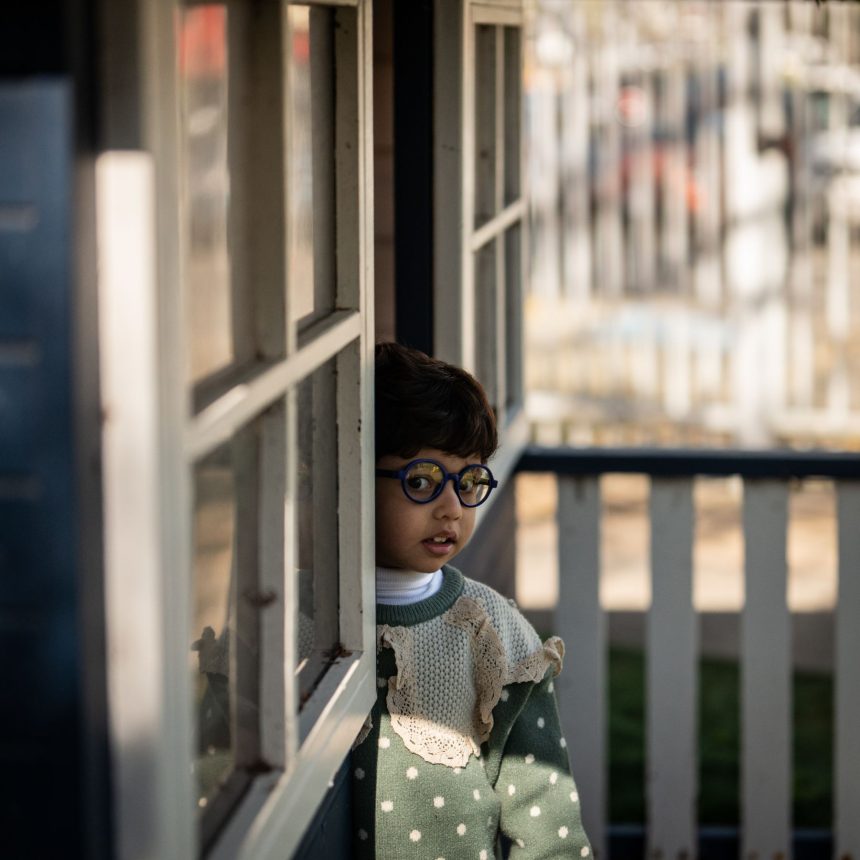 Boy looking out doorway