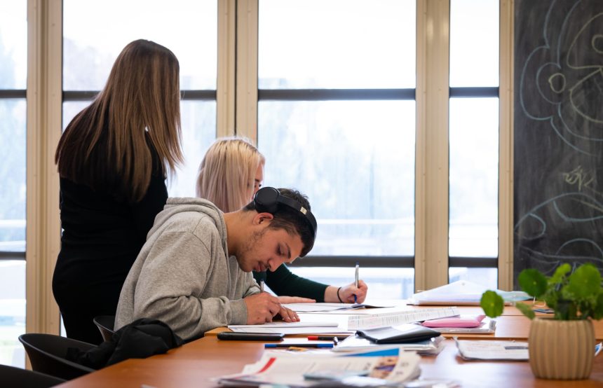 Three people studying