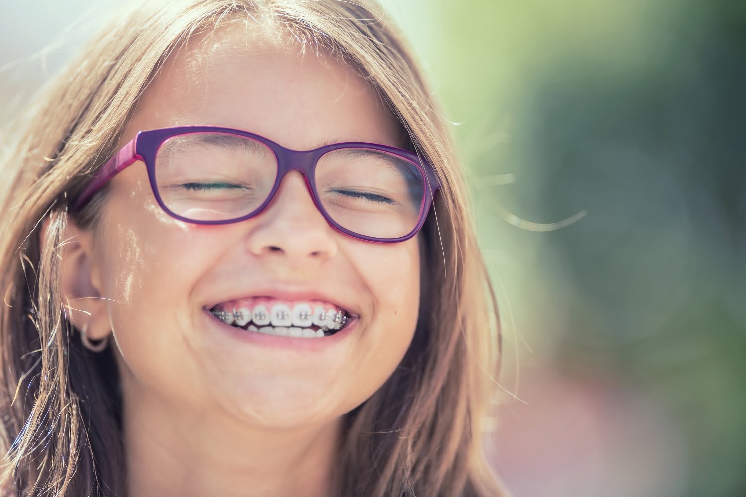 Young girl smiling at camera